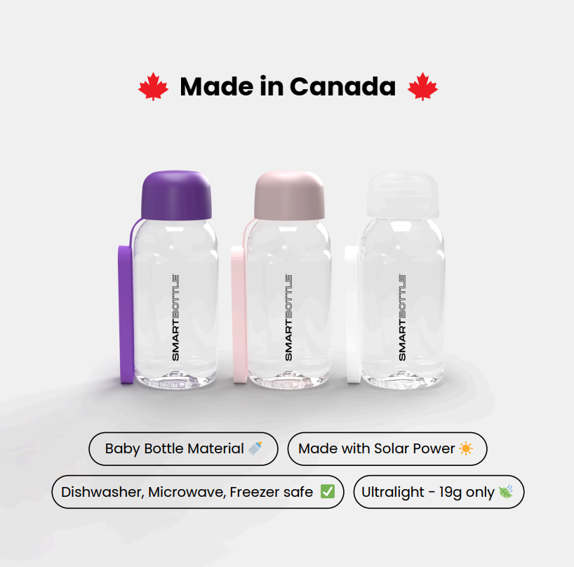 Three clear baby bottles with colored lids on a white background, featuring the brand 'Smart Bottle'.